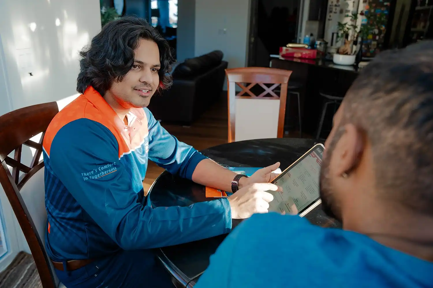 Comfort Union technician discussing services with a customer